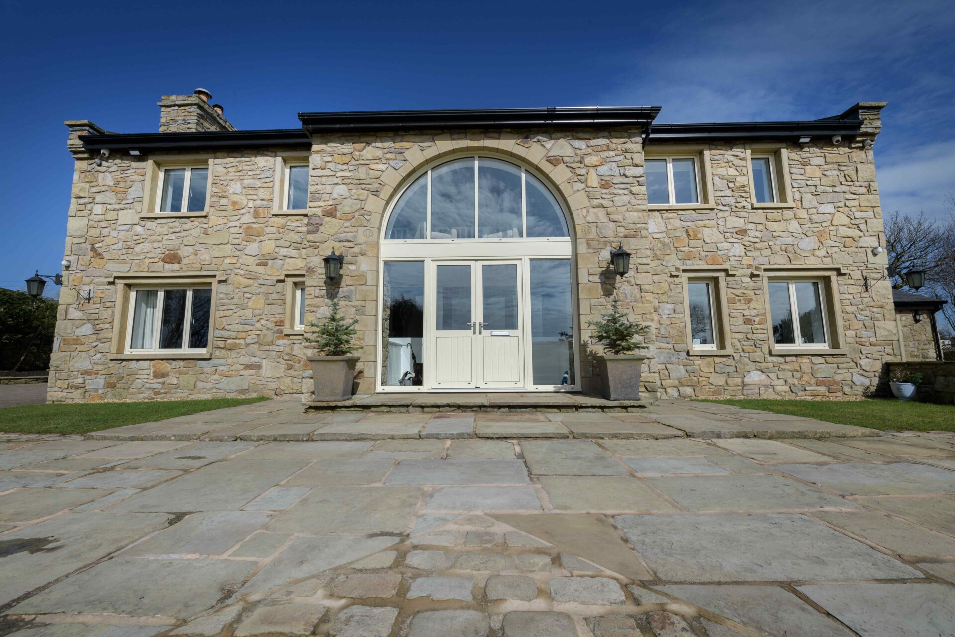 External Doors : smart glazed double doors in a light brick house