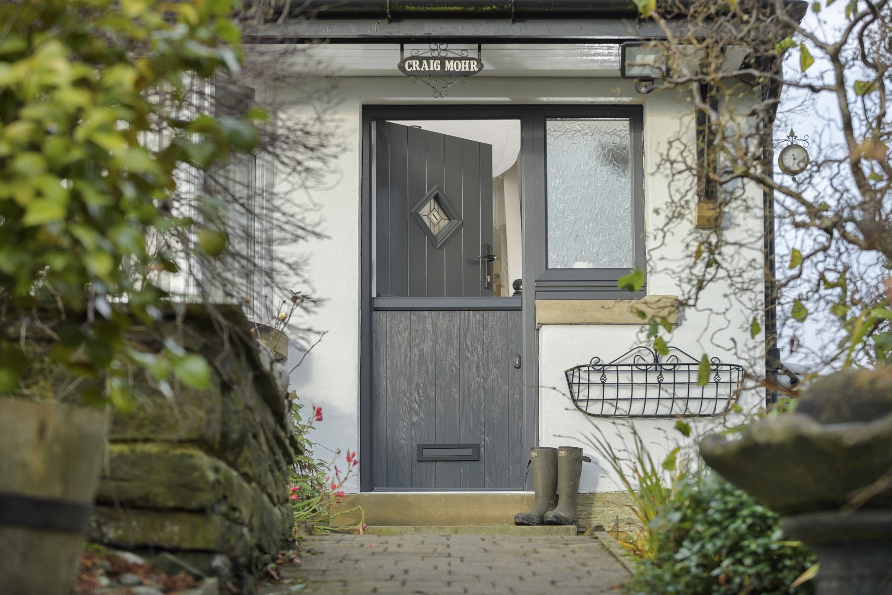 Stable Doors : black stable door in a cottage setting