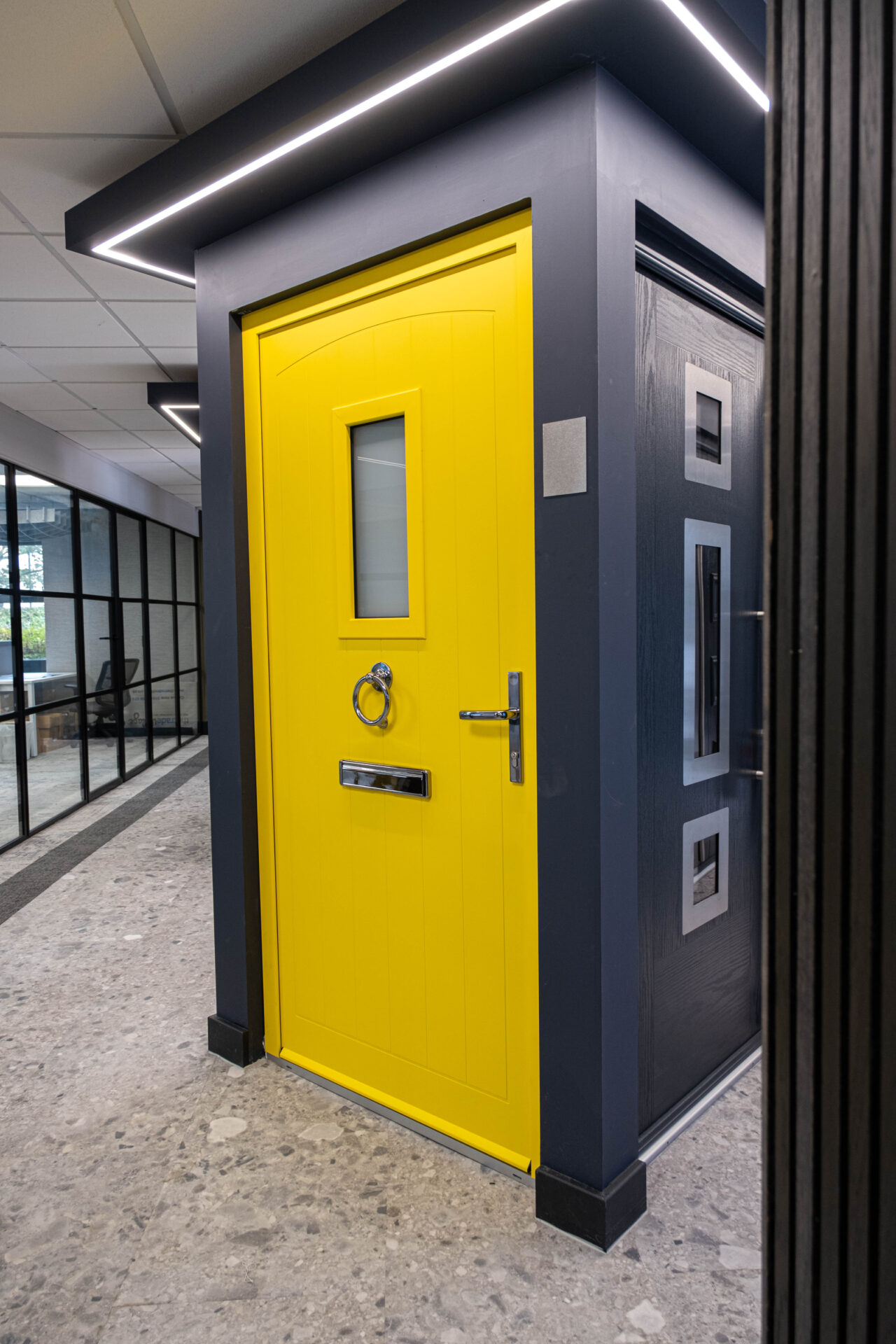 front door colour : Bright yellow smart front door in the GFD Homes showroom