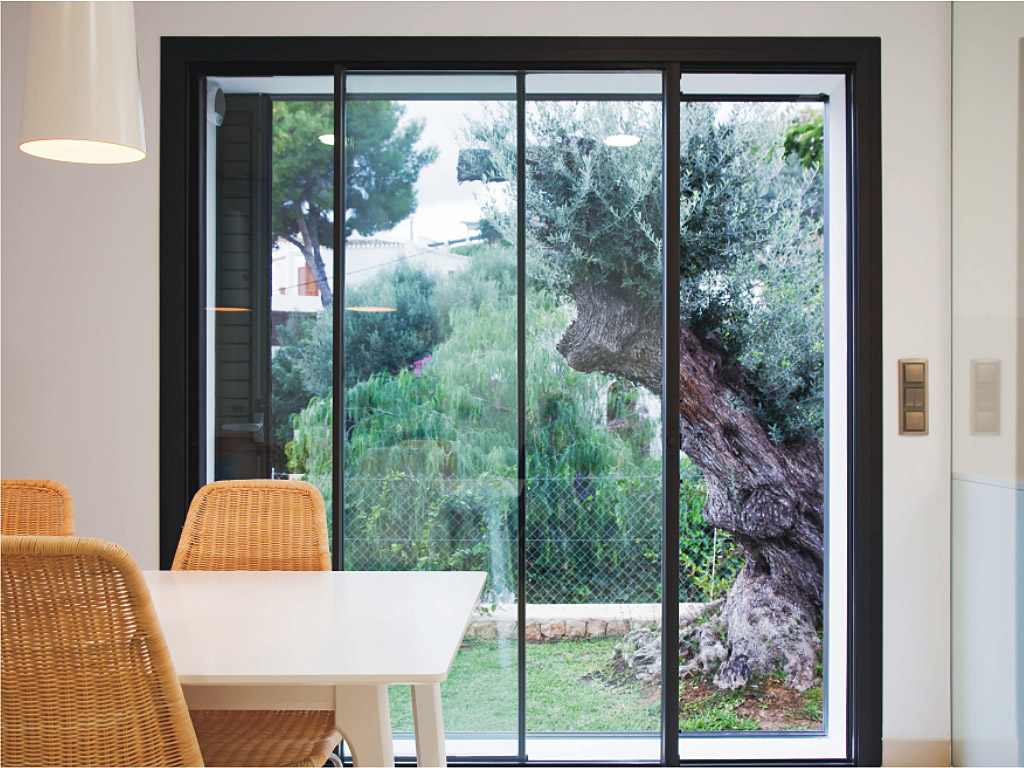 front doors : Cortizo sliding door installed in dining room with garden in view.