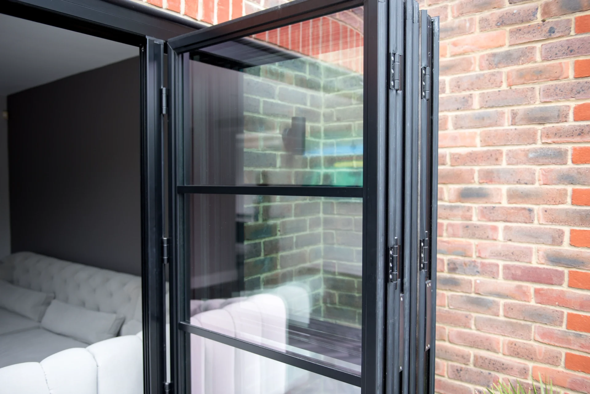 front doors : bifold doors folded back like an accordian.