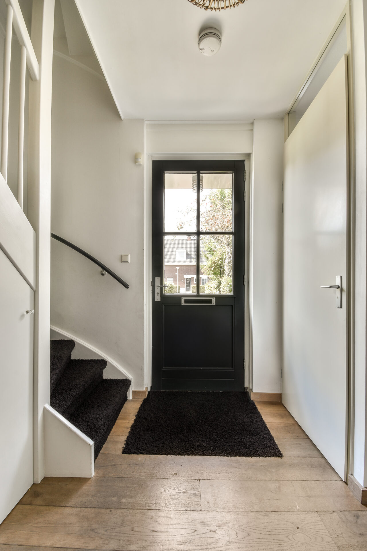 black upvc front door : a black entrance door provides a stunning contrast when paired with a white interior