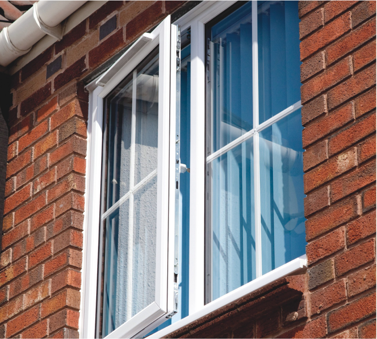 how to make your home more energy efficient: exterior shot of a upvc window that has been left ajar