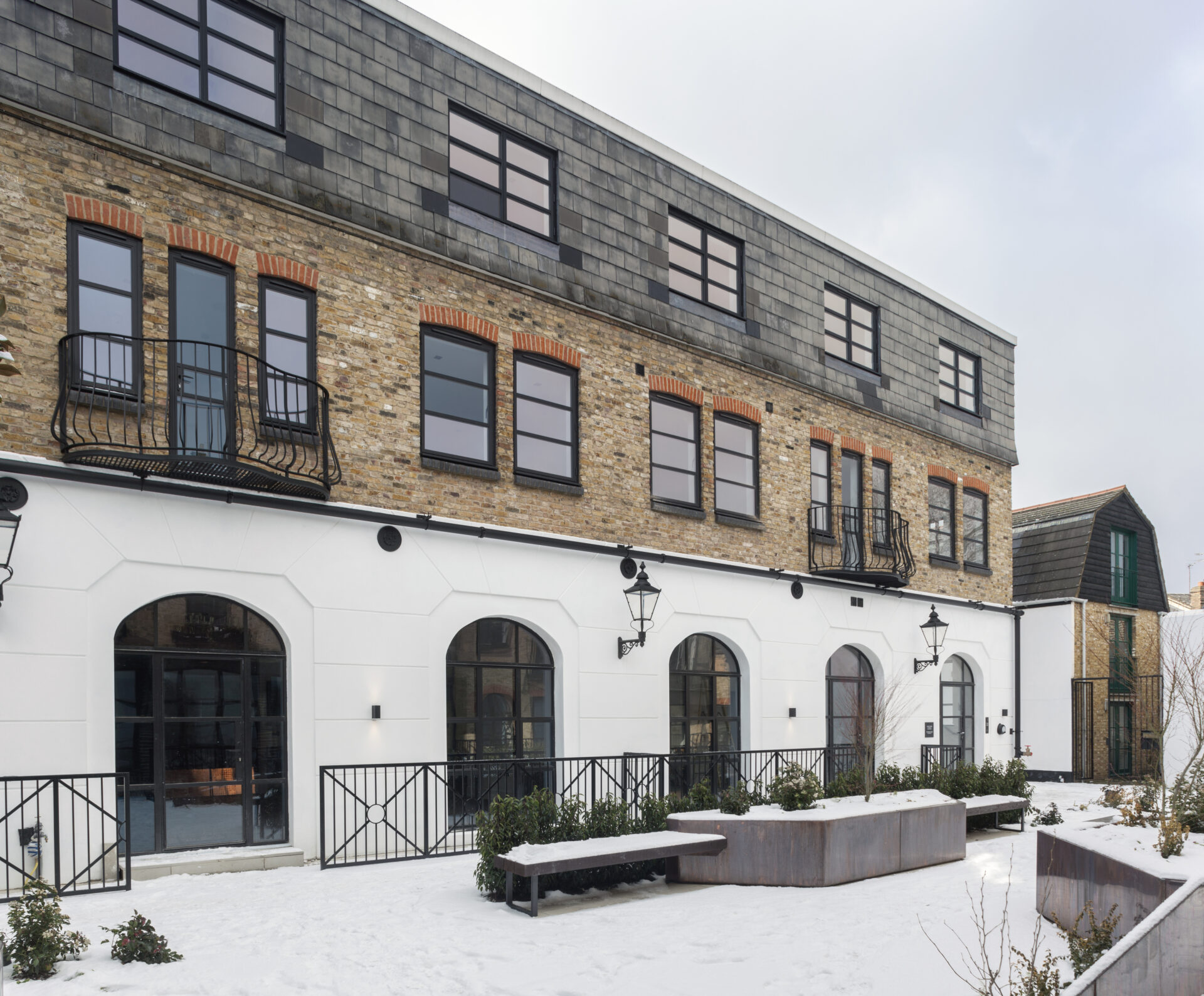 aluminium framed windows: Side view of a large commercial property with large, black aluminium windows.