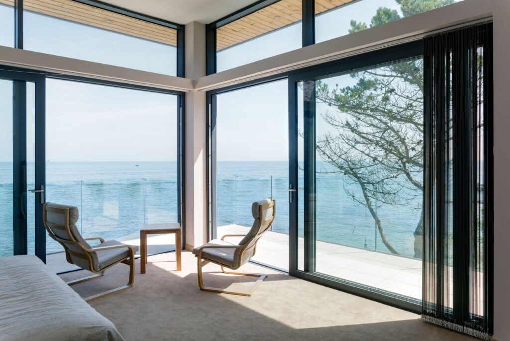 Sliding doors installed in bedroom adjacent to one another to create a corner.