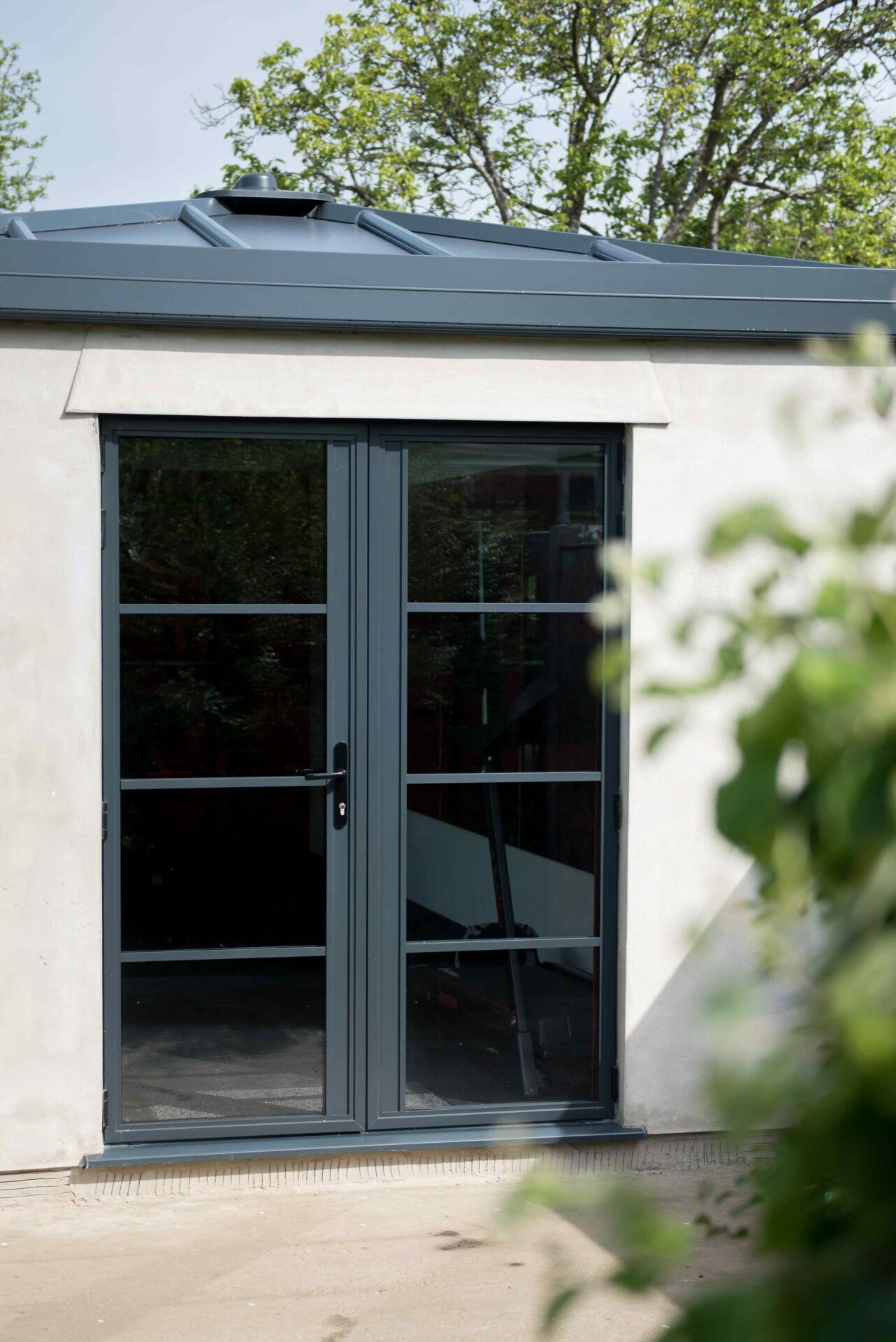 French doors installed on outbuilding of property.