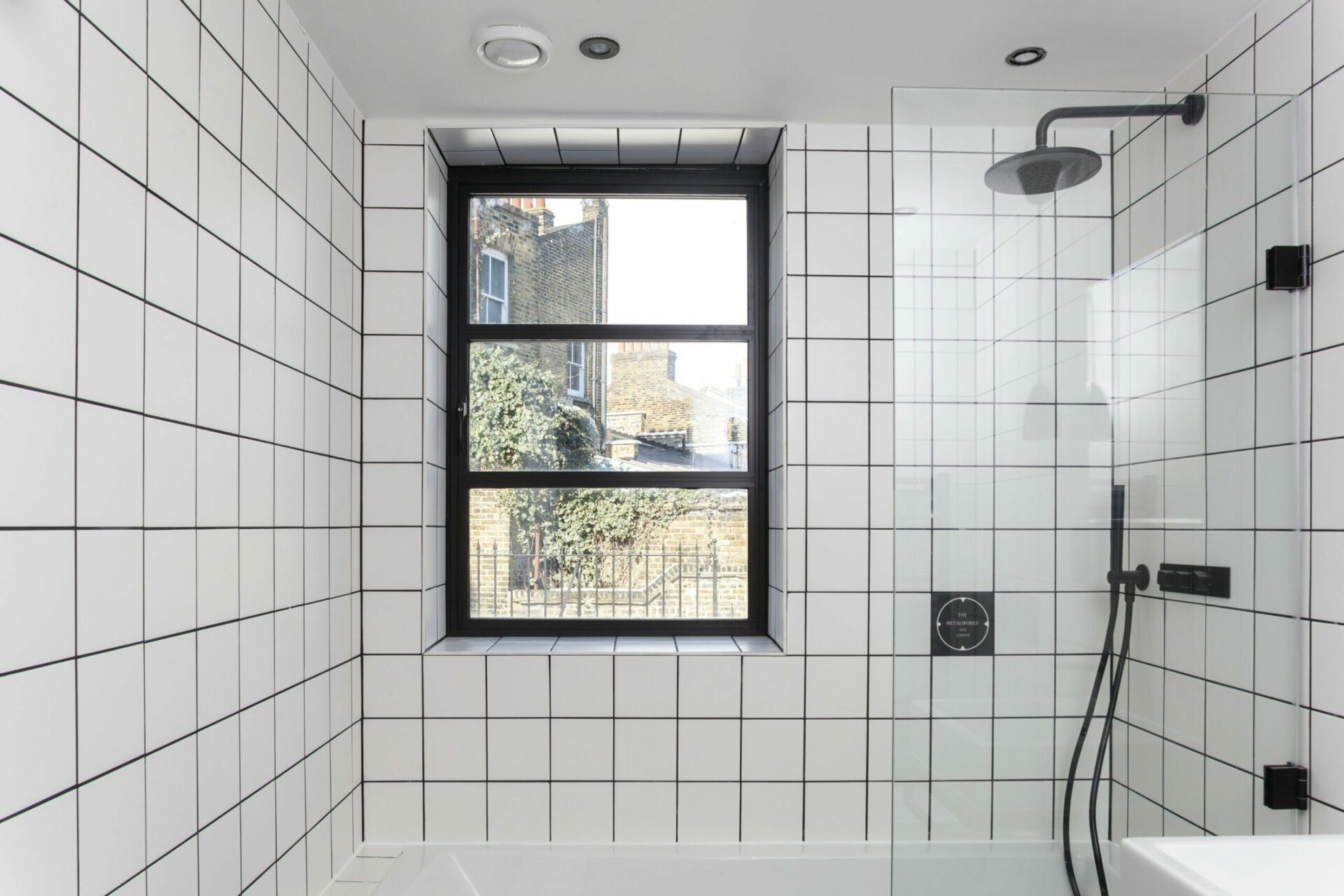 Industrial style windows: installed in a bathroom. 