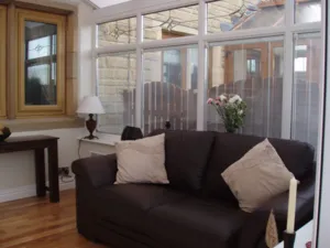 Integral blinds installed in a living room area.
